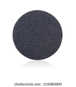 Sandpaper. Round sanding paper with Velcro, isolated on white background. Fine grains of sand are visible on the surface of the sandpaper. Abrasive disc. Round abrasive paper.
