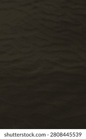 Sandscape with dune patterns, muted tones, gentle wind lines, and tranquil vastness.