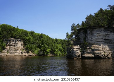 Sandstone rock formations alongside the banks of the Wisconsin River near Wisconsin Dells. - Powered by Shutterstock