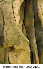Sandstone rocks formations with deep crevices - abstract backgrounds