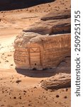 Sandstone tombs in the desert land of AlUla Medina Saudi Arabia in Hegra of UNESCO, World Heritage Site