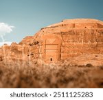 Sandstone tombs in the desert land of AlUla Medina Saudi Arabia in Hegra of UNESCO, World Heritage Site