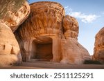 Sandstone tombs in the desert land of AlUla Medina Saudi Arabia in Hegra of UNESCO, World Heritage Site