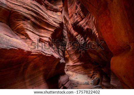 Sandstone walls in Red Canyon Slot Aka Peekaboo. Utah, USA
