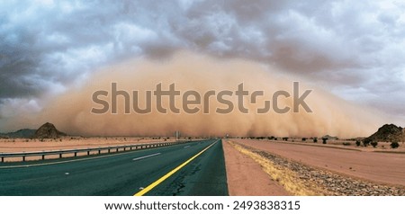 Sandstorm wall with rain clouds
