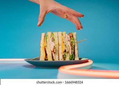 Sandwich Being Taken By Hand