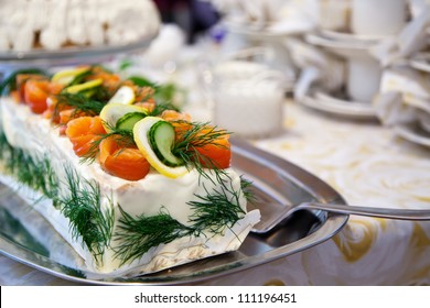 Sandwich cake with salmon, lemon and cucumber