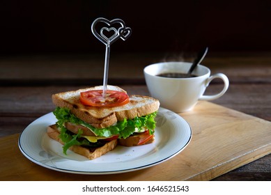 Sandwich Cheese And Thick Ham With Veg. In White Dish And Black Coffee All Put On Wooden Chopping Board / Select Focus, Space For Text

