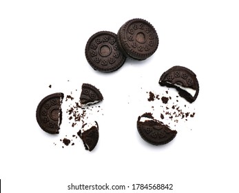 Sandwich Chocolate Cookies With A Sweet Cream With Crumbs Isolated On White Background.   