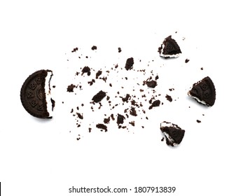 Sandwich Chocolate Cookies With A Sweet Cream With Crumbs Isolated On White Background.   