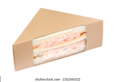 Sandwich With Crab Stick In Brown Cardboard Triangle Packaging Isolated On White Background