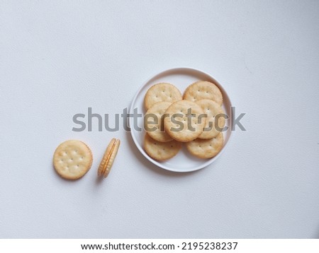 Sandwich crackers with cheese cream inside. Top view or flat lay photography concept. Isolated background in white