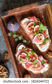 Sandwich With Goat Cheese Spread, Prosciutto, Figs And Chopped Walnuts