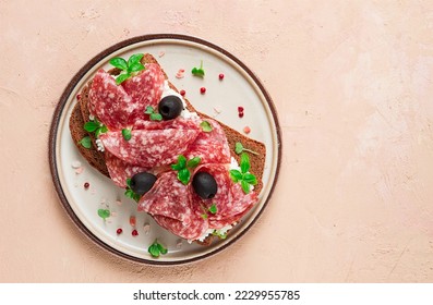 Sandwich , grain bread, with cream cheese and salami, black olives, micro-greens, top view, close-up, no people, Breakfast, - Shutterstock ID 2229955785