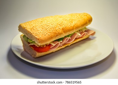 Sandwich With Ham And Cheese On A Plate