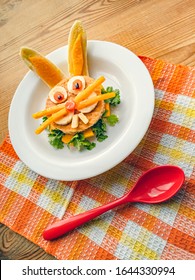 Sandwich Made And Garnished In The Shape Of Rabbit Face To Attract Children. The Sandwich Is Made Of Bred Slice, Papaya, Tomato, Banana And Coriander Leaf. It Is Placed In A White Plate.