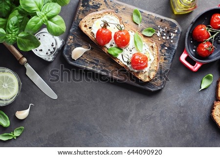 Similar – Image, Stock Photo Bruschetta with cream cheese, cherry tomatoes and basil