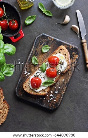 Similar – Image, Stock Photo Bruschetta with cream cheese, cherry tomatoes and basil