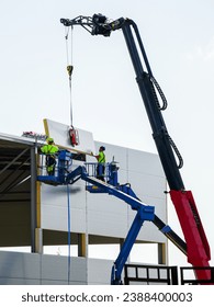 Sandwich panels wall assembly using telescopic boom crane and two self propelled articulating boom lifts, sandwich panels wall mounting