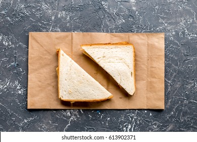 sandwich and paper bag on table background top view mock-up