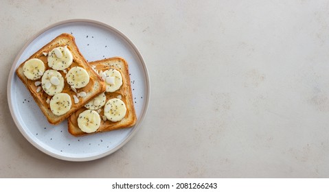 Sandwich with peanut butter, banana and chia seeds. Breakfast. Vegetarian food - Powered by Shutterstock