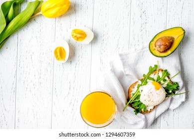 Sandwich With Poached Eggs On Wooden Background Top View Mockup