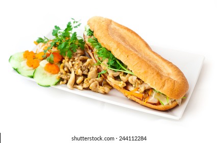 Sandwich prepared with kebab curry chicken meat, baguette and fresh vegetables: cucumber, carrots, parsley and tomato. Healthy, tasty food. Restaurant, menu, snack, lunch time, lunch.