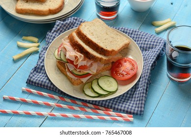 Sandwich With Roast Turkey, Cucumbers And Tomato - Closeup