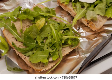 Sandwich With Rocket Salad On Aluminum Foil