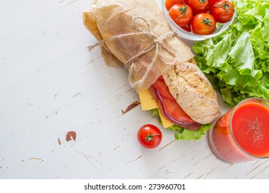 Sandwich With Salad, Cheese, Ham, Tomatoes, Red Onion, Juice, Ingredients, White Wood Background, Top View