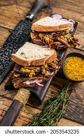 Sandwich With Slow Smoked Pulled Pork Meat On White Bread. Wooden Background. Top View