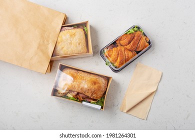 Sandwich In Takeaway Or Delivery Food Container On Marble Table, Top View