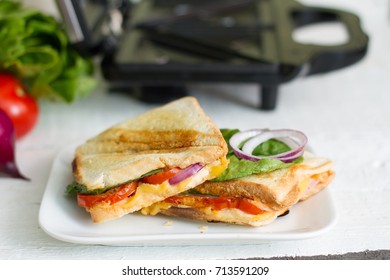 Sandwich Toaster With Toast And Ingredients