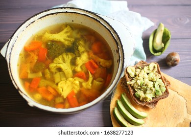 Sandwich Vegetable Soup With Avacado On A Table In A Pan Top View