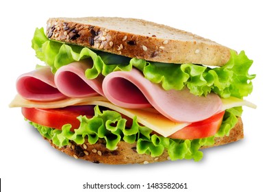 Sandwich with whole grain bread, salad, cheese, tomato and ham on a white isolated background. toning