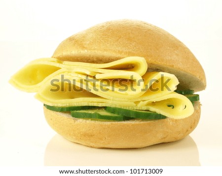 Similar – Image, Stock Photo Bread buns in a basket hanging on a blue wall