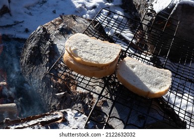 Sandwiches being made on a campfire