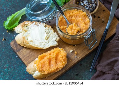 Sandwiches With Butter And Salted Caviar On A Dark Stone Countertop.