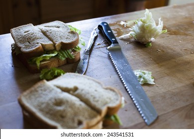 Sandwiches cut in half on cutting board