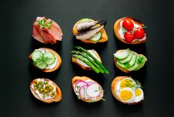 Sandwiches On A Dark Background, Or Assorted Canapes, Top View