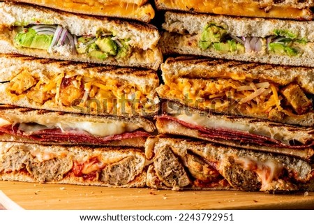 Sandwiches. Roast Beef or Cuban Sandwich. Classic American Diner sandwich. Thinly sliced roast beef topped with melted Swiss cheese on top of a toasted hero roll with lettuce tomato and onion. 