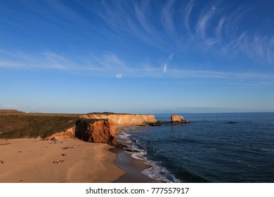 Sandy Beach At Base Of Seacliffs With Evening Sun