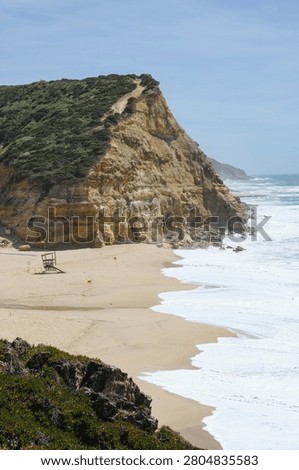 Sandy Beach with Cliffs and Crashing Waves, Portugal Coas
