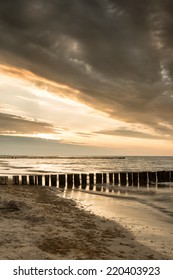 Sandy beach in the dramatic sunset