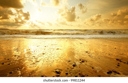 Sandy Beach At Golden Sunset