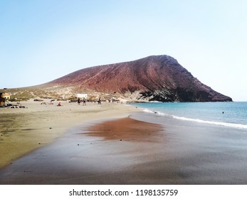 Sandy beach with mount
