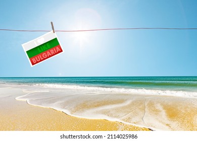 Sandy Beach On The Gold Beach On The Bulgarian Black Sea Coast With Bulgarian Flag