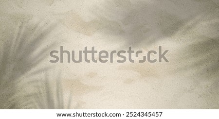 Sandy beach pattern and palm leaf shadow. Summer background with coconut leaf shadow, top view