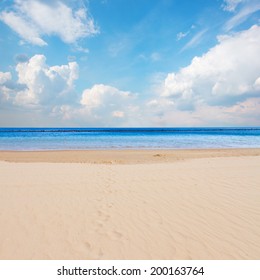 Sandy Beach Sea Shore With Blue Sky