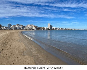 Sandy beach with small waves
